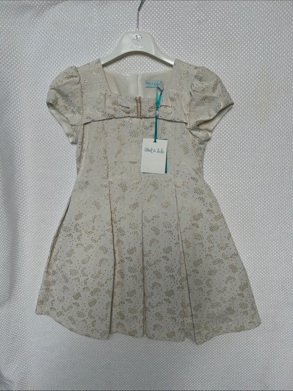 NWT! Abel & Lula Stunning Cream Party Dress with Gold Sparkle Bow. Fully lined